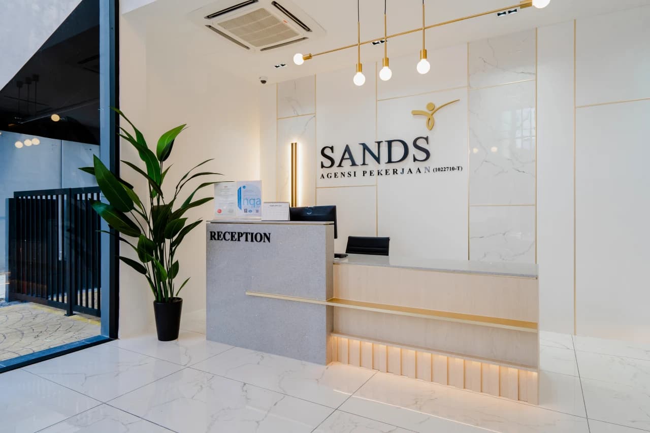 Staff handing document to client during consultation