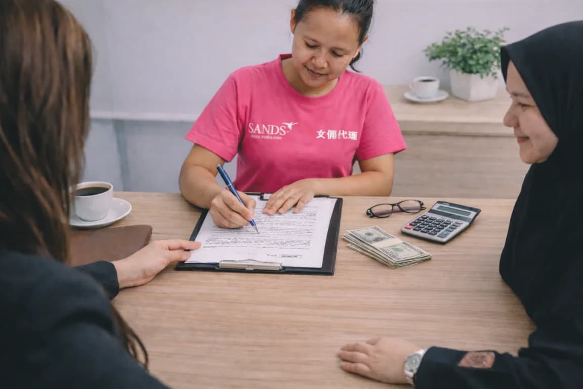 Staff and client reviewing documents