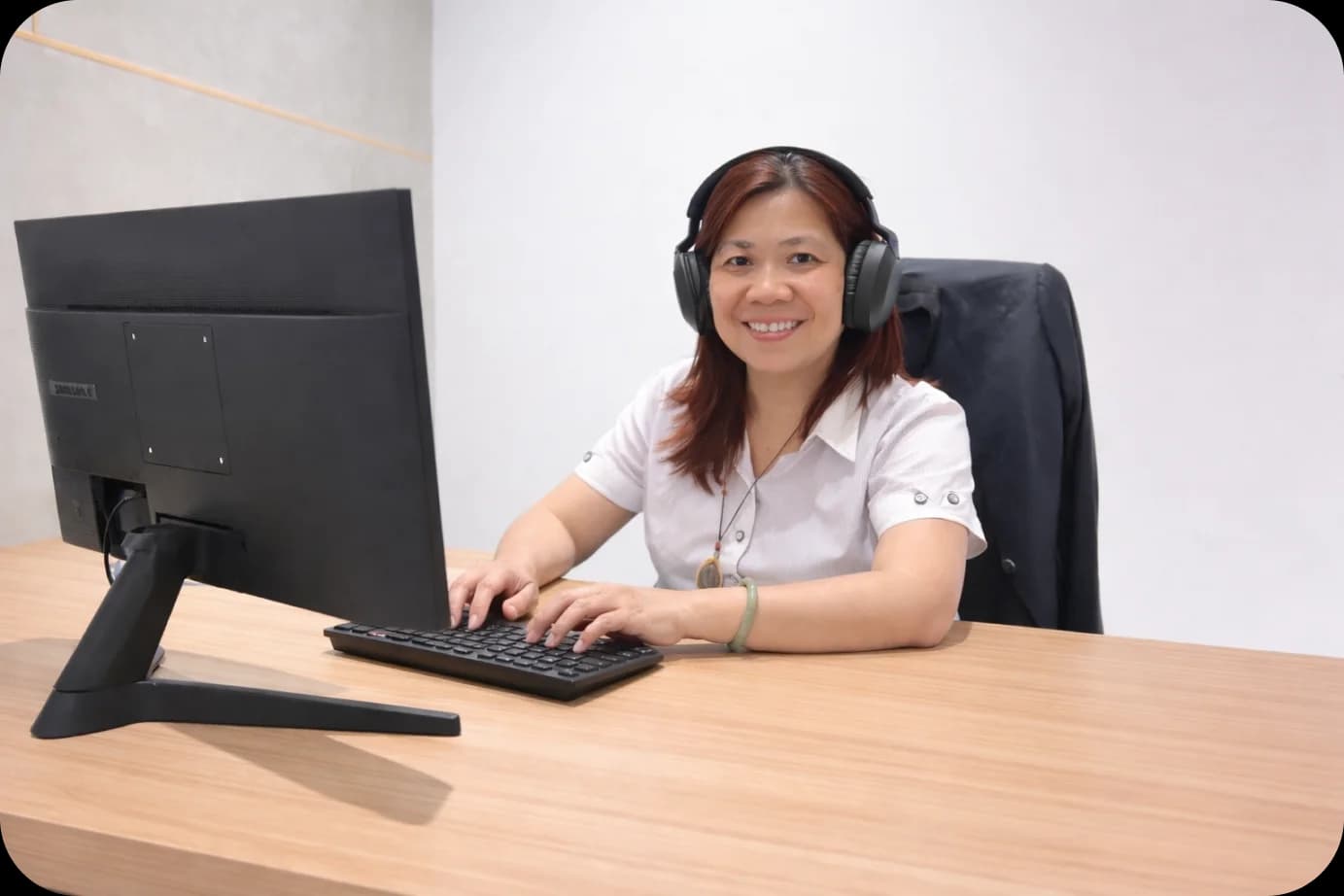 Woman with headset at desk
