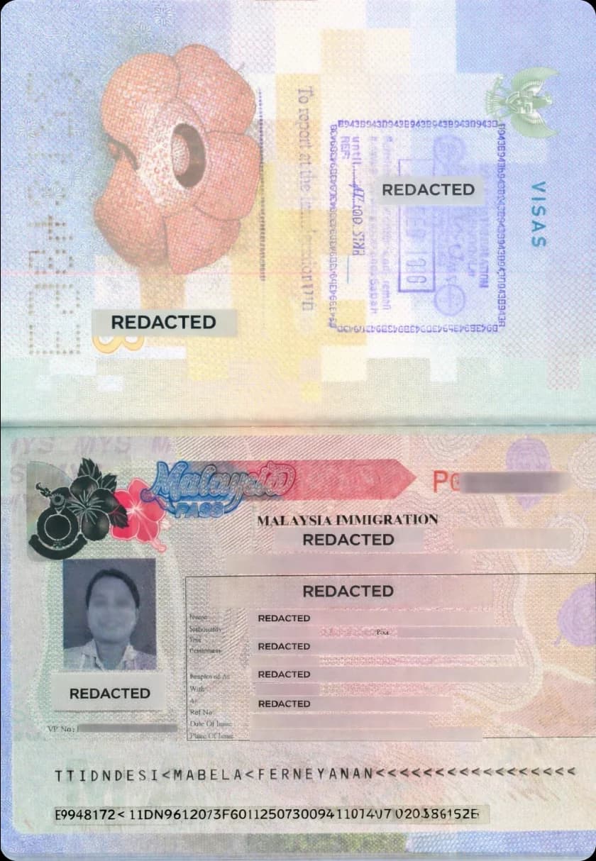 Employer signing work permit renewal form with maid